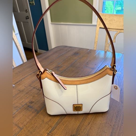 Dooney & Bourke Handbags - Dooney & Bourke Patent Leather Baguette White Shoulder Bag. NWOT